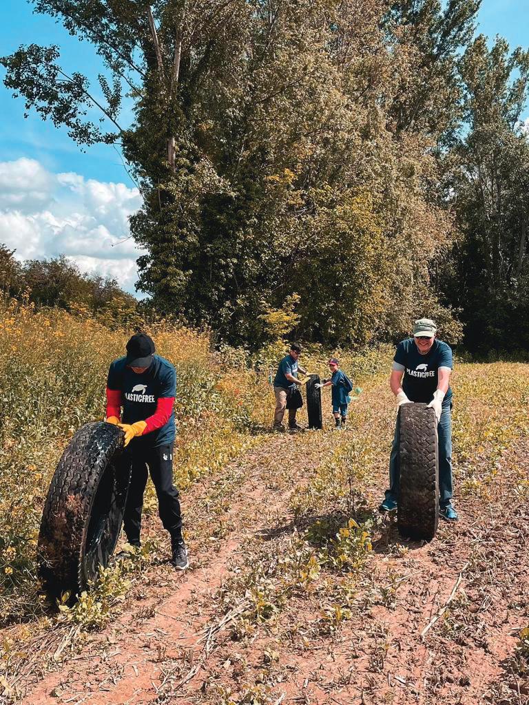Volunteers collect tires